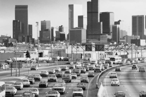 View of Interstate Highway 25 in the Five Points Neighborhood of Denver, Colorado; downtown skyscrapers fill the scene.