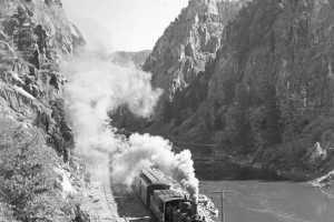 Denver and Rio Grande Western Railway Company (D&RGW) narrow gauge Rocky Mountain Railroad Club Special by the Curecanti Needle in the Black Canyon of the Gunnison, 2-8-0 361, 11 cars