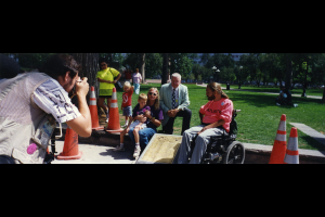 Wade Blank, his son Lincoln, and fellow Atlantis cofounder Michael Auberger celebrate the laying of the plaque, dedicated to the original protesters - The Gang of 19 - who blocked the intersection to protest the inaccessible buses in 1978. WH2283/Box5/F16